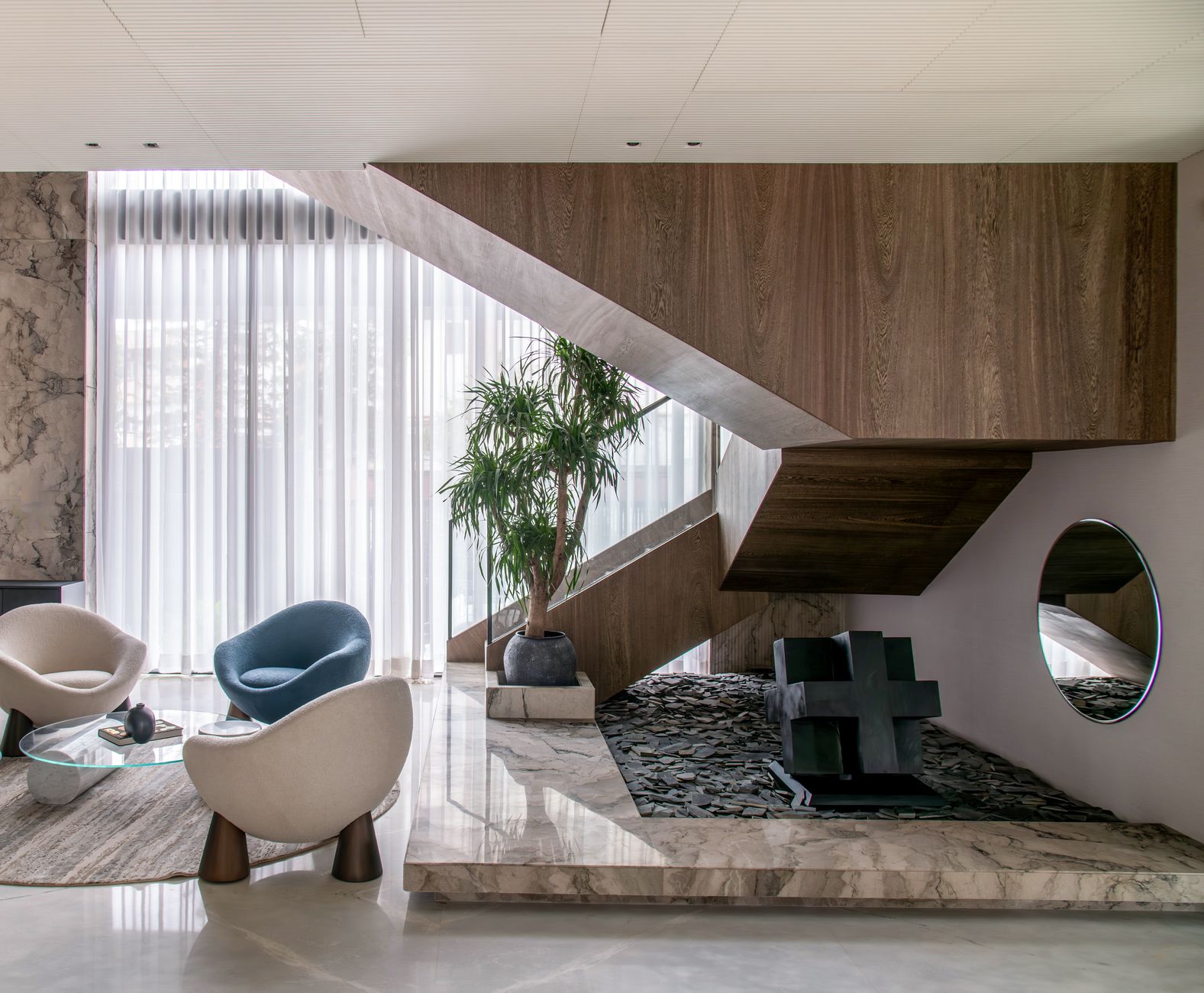 Chic interior showcasing a modern staircase, elegant seating, and decorative elements. — Christmas Pokies