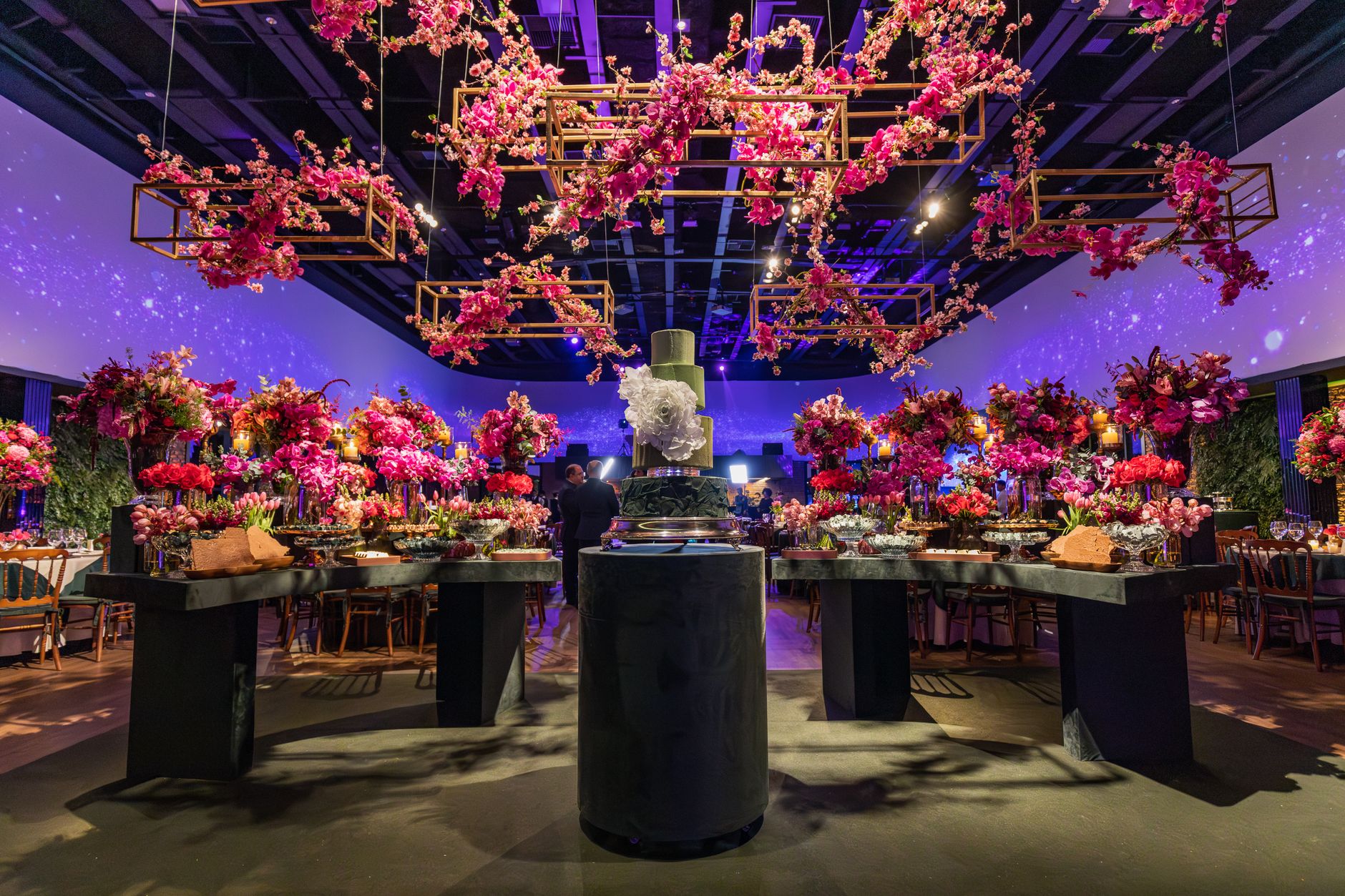 Lavish interior with vibrant floral decorations in a luxurious venue setup, perfect for celebrations. — E Wedden Tips