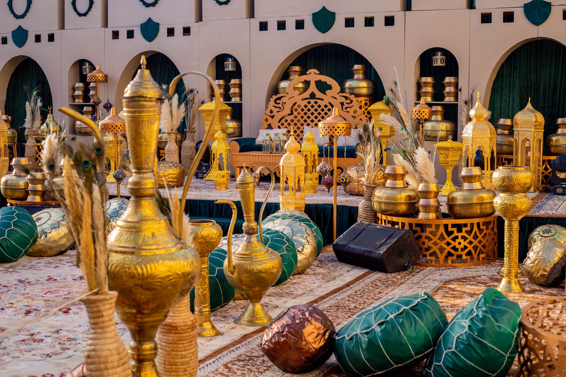 Exquisite traditional Nigerian event setup with ornate golden vases and cushions, perfect for cultural celebrations. — El Roy