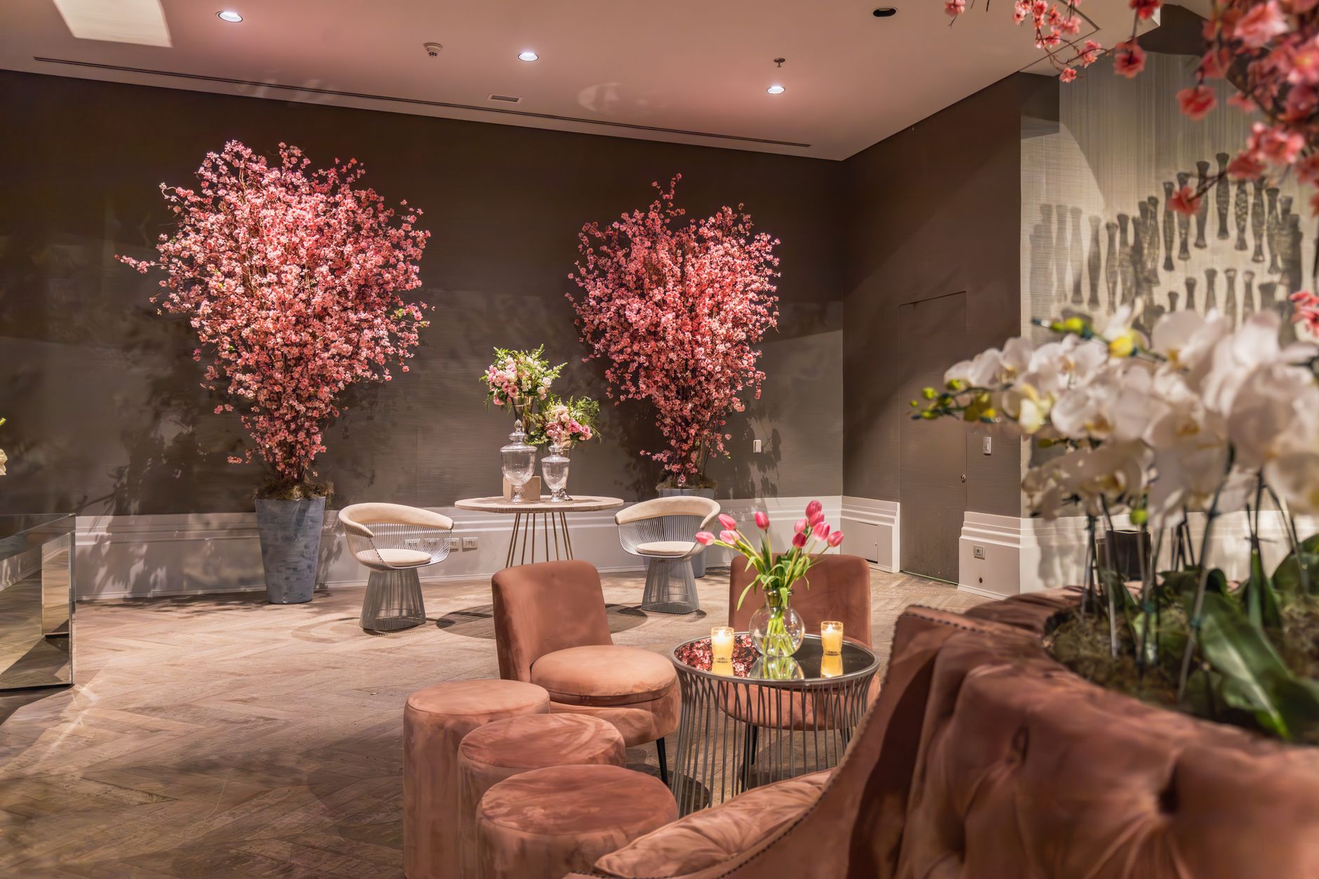 Luxurious indoor lounge featuring modern furniture and stunning cherry blossoms. — Scommesse Italia Hockey