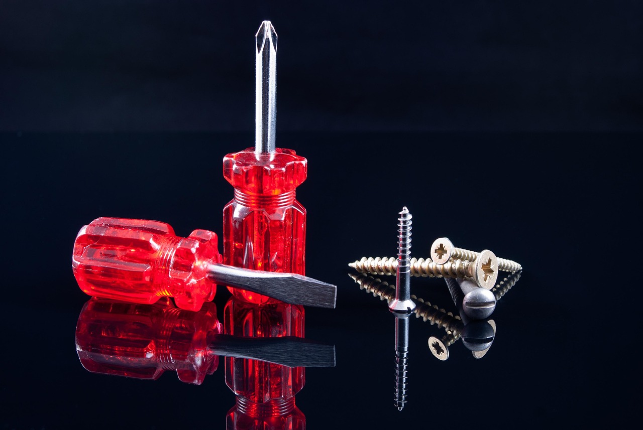 Screwdrivers, screws, red — Transform Your Living Space With a Stylish Bathroom Remodel in Burlington