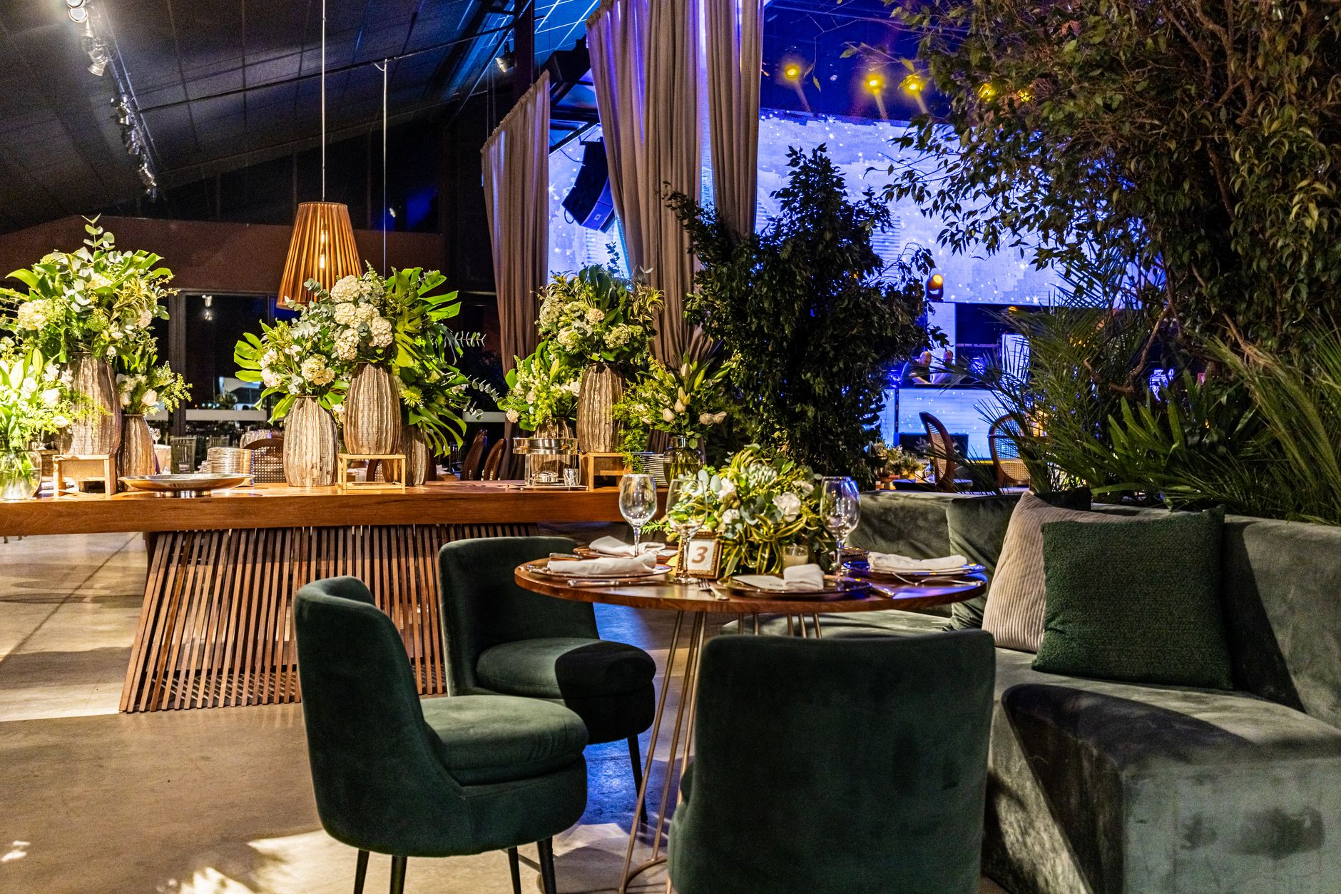 Luxurious indoor setting featuring ornate floral arrangements and elegant seating, perfect for special occasions. — Wingaga A